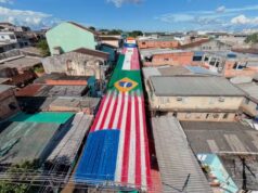 Com bandeirinhas e pinturas, ruas de Manaus se transformam para jogos do Brasil na Copa do Mundo